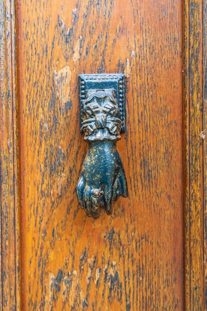 France-Dordogne-Hautefort A metal door knocker in the shape of a hand in the town of Hautefort